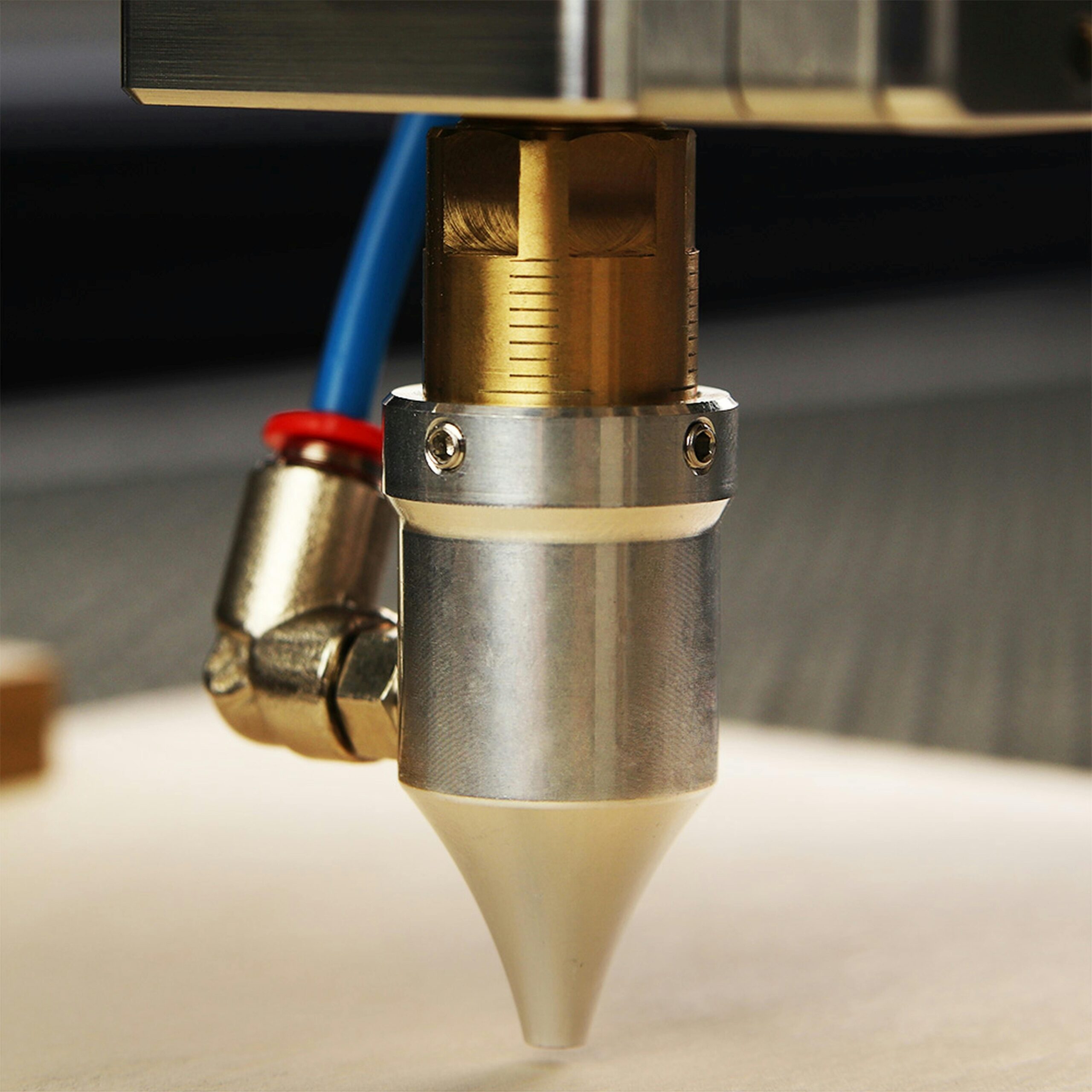 Detailed view of a CNC laser engraver focusing on precise metalwork.